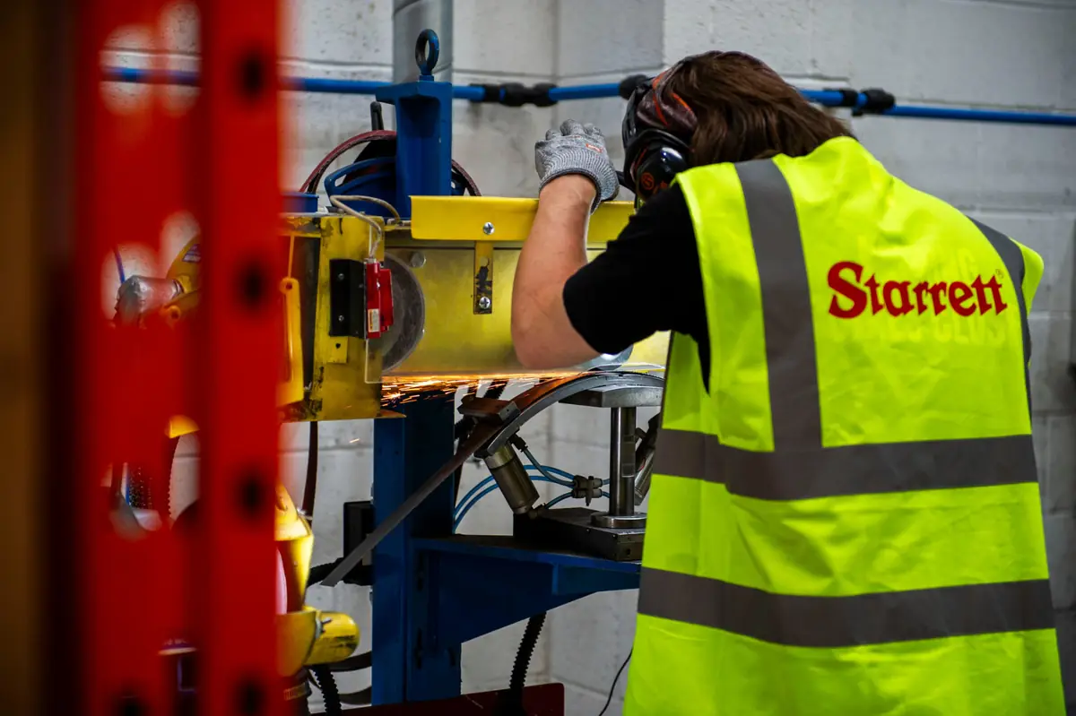 Bandsaw blade weld being linished at the Nottingham Weld Centre